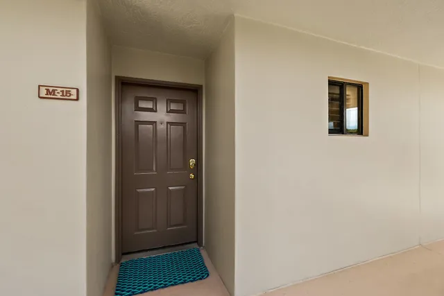 a kitchen with a sink stainless steel appliances and counter space
