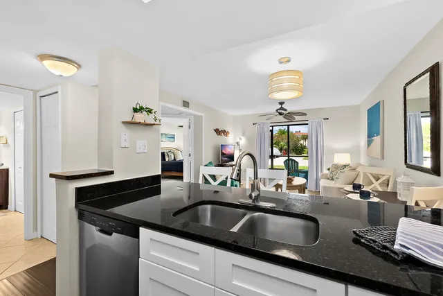 a living room with furniture a window and a dining table