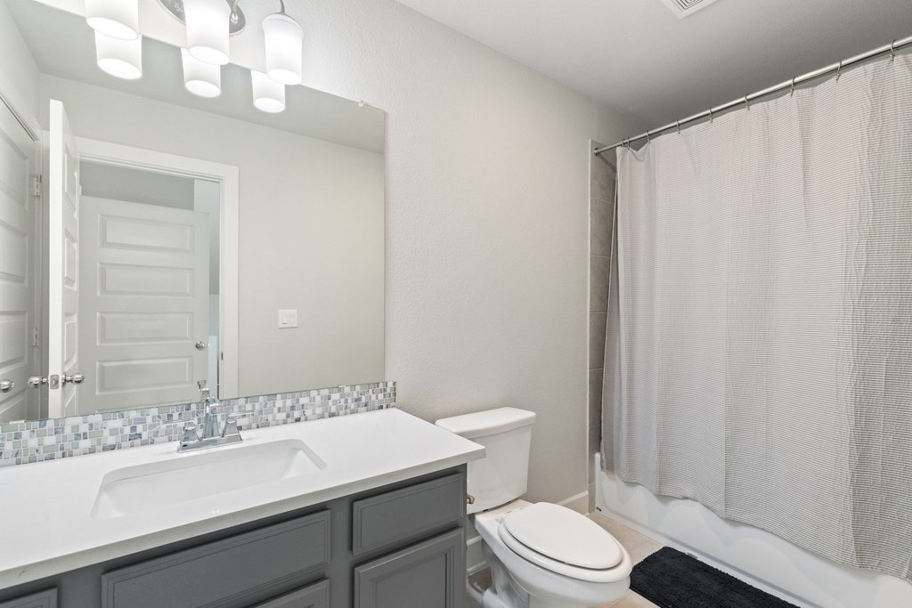 741 Rawson Bend Austin, TX 78738 - Photo 33 of 40 The other full secondary bathroom upstairs. There is also a main floor guest powder room.