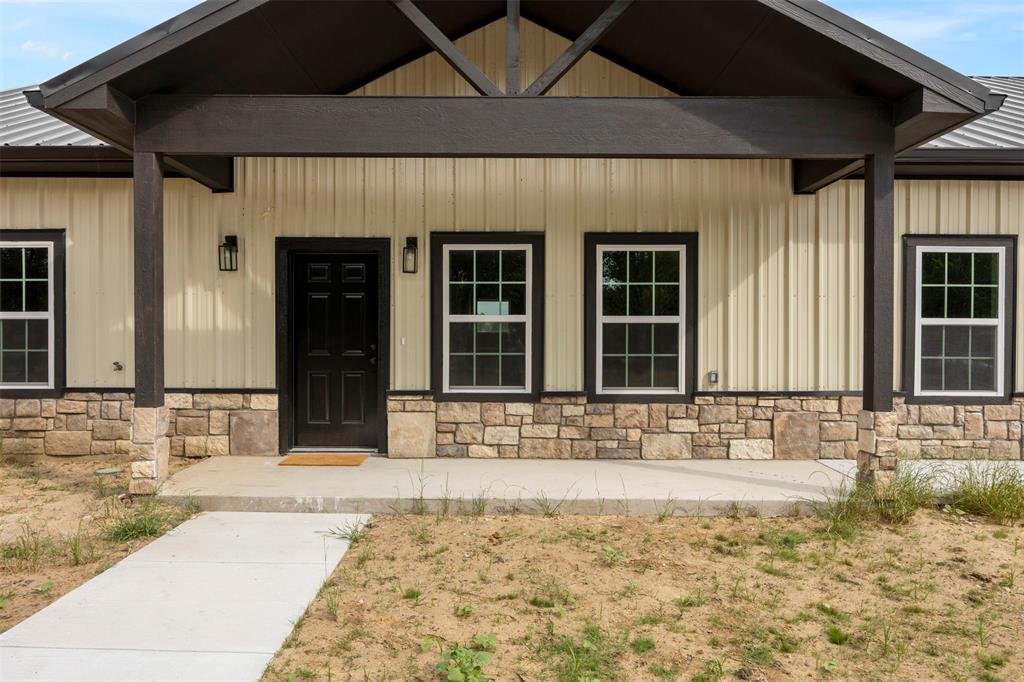 121 Brazier Road Ennis, TX 75119 - Photo 2 of 31 a view of a entryway of a house