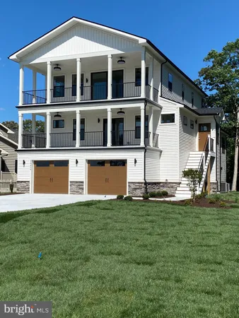 a house with lots of trees in the background