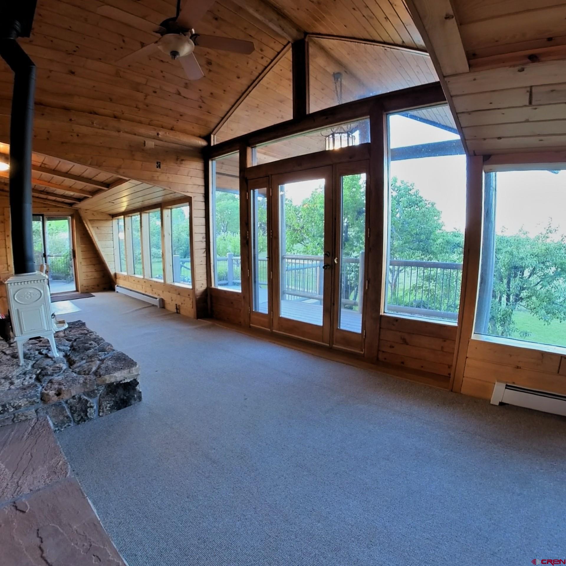 24119 Ute Trail Road Cedaredge, CO 81413 - Photo 12 of 26 a living room with furniture and a large window