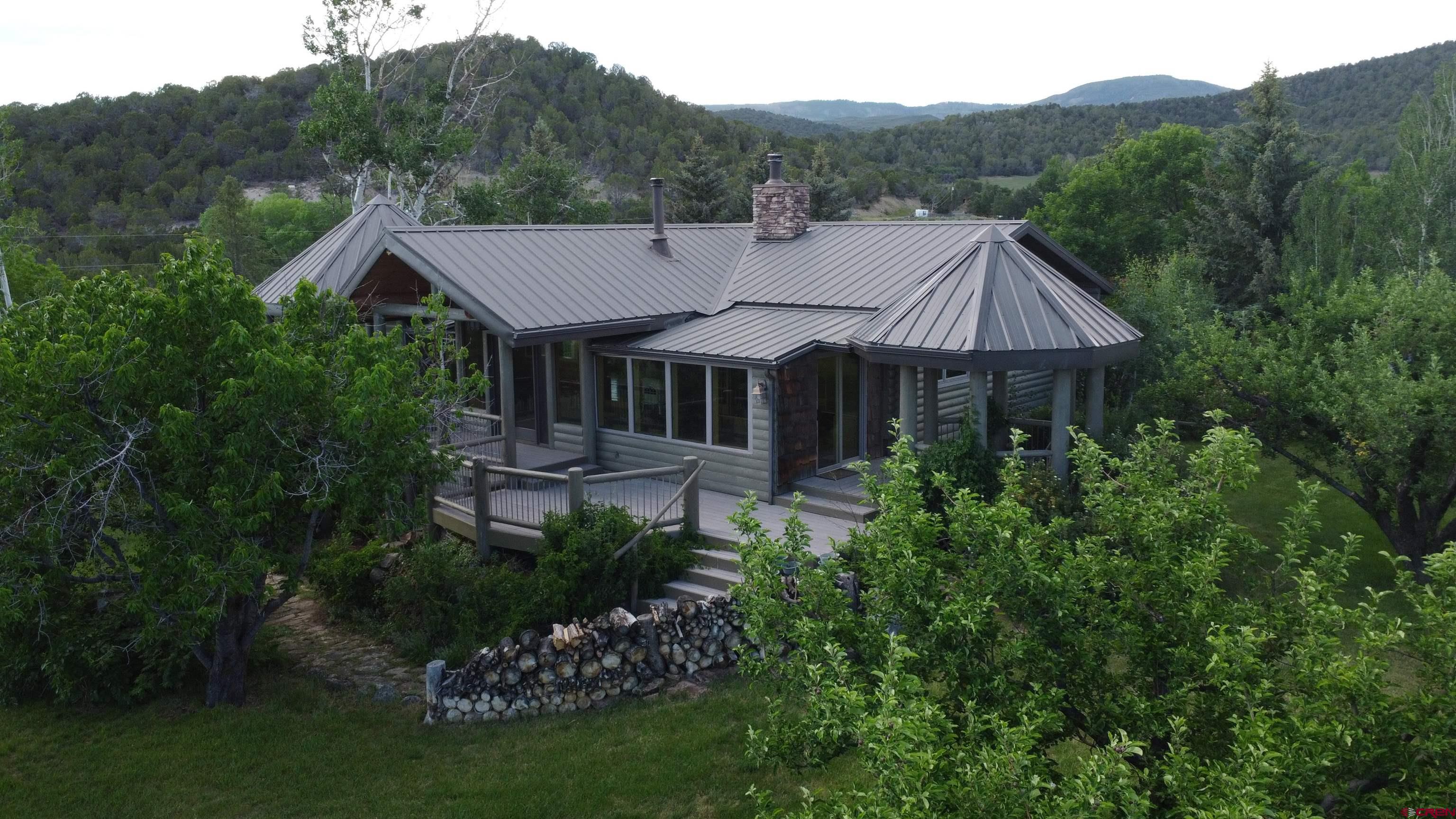 24119 Ute Trail Road Cedaredge, CO 81413 - Photo 22 of 26 a aerial view of a house with a big yard