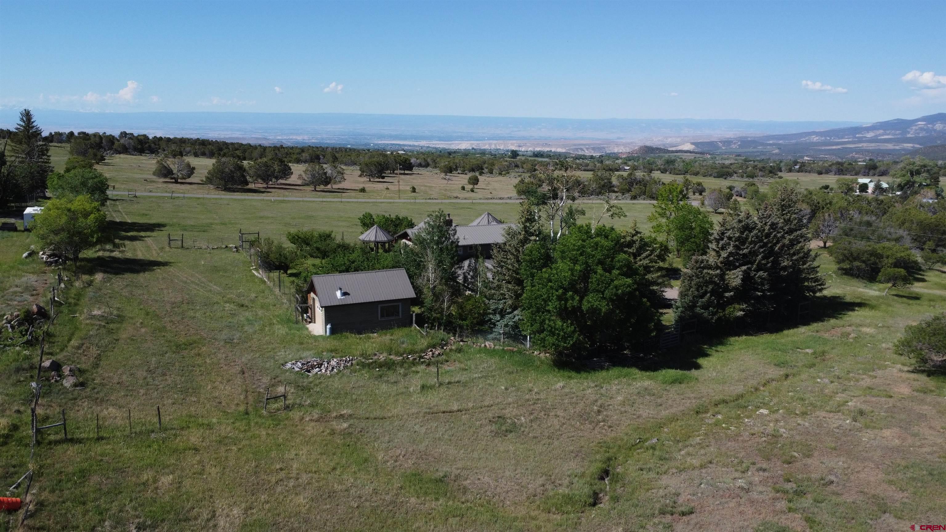 24119 Ute Trail Road Cedaredge, CO 81413 - Photo 24 of 26 an aerial view of a house with a yard