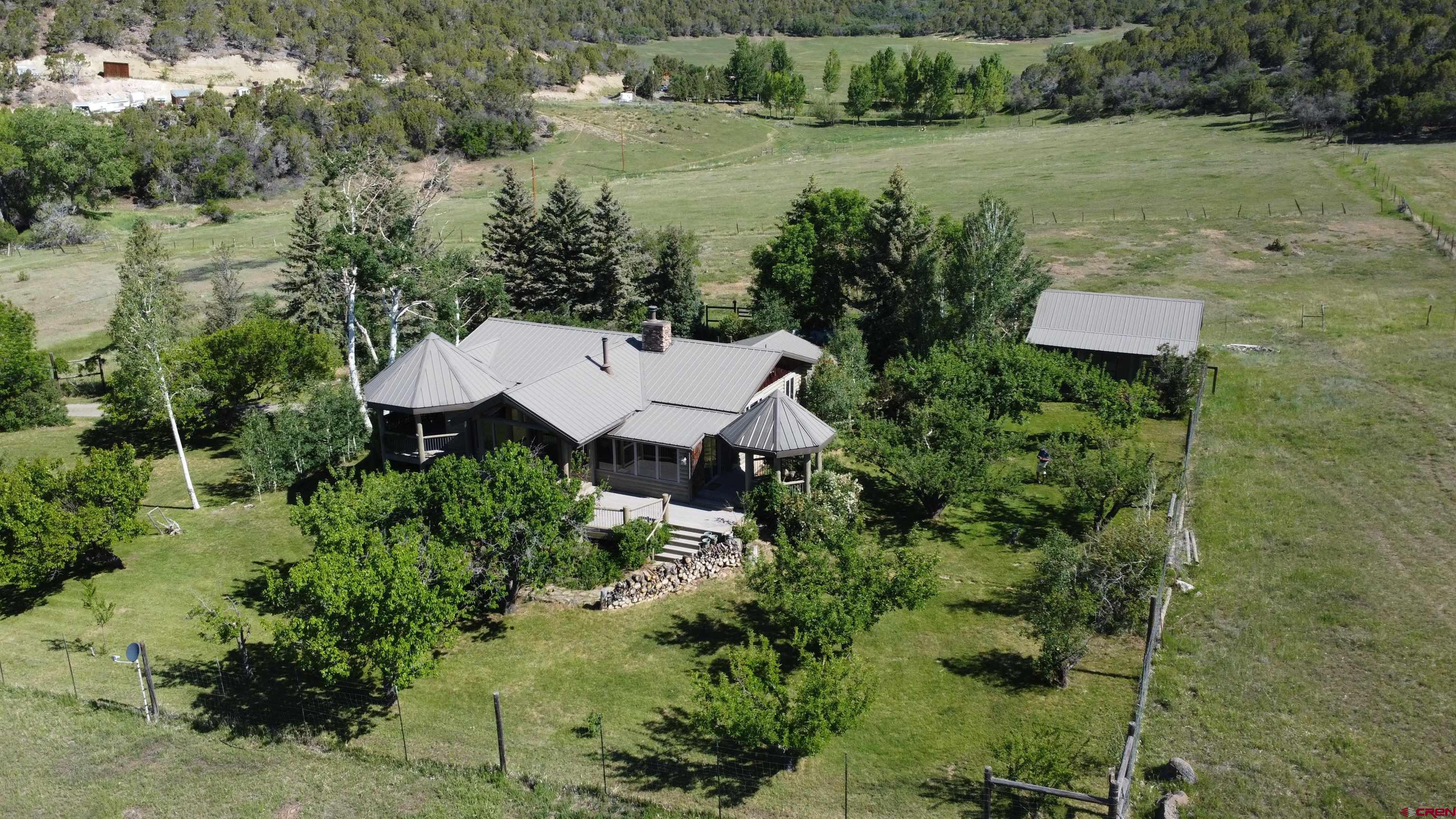 24119 Ute Trail Road Cedaredge, CO 81413 - Photo 26 of 26 an aerial view of a house with pool and a yard