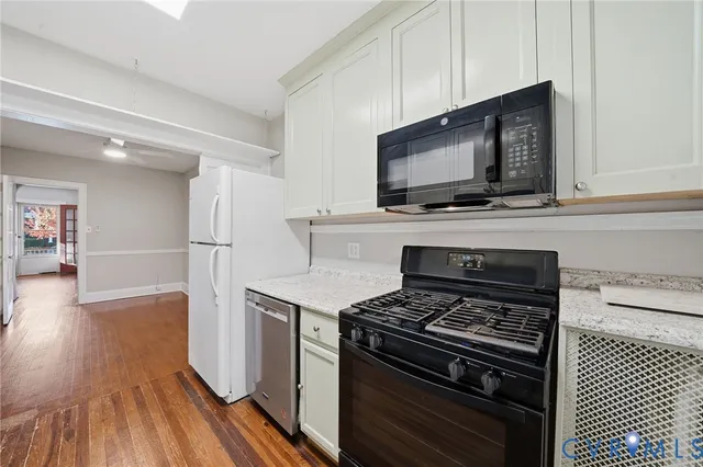 a kitchen with a stove and a microwave