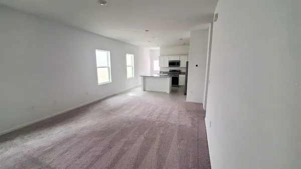 a view of a kitchen and a windows in a room