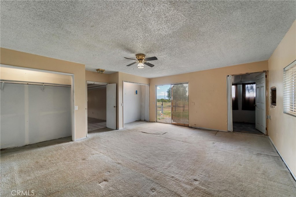 33041 Briggs Road Menifee, CA 92584 - Photo 25 of 60 a view of a livingroom with a ceiling fan