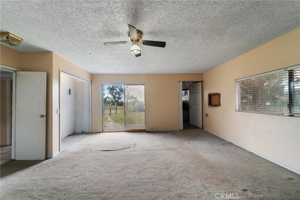 33041 Briggs Road Menifee, CA 92584 - Photo 26 of 60 an empty room with windows and closet