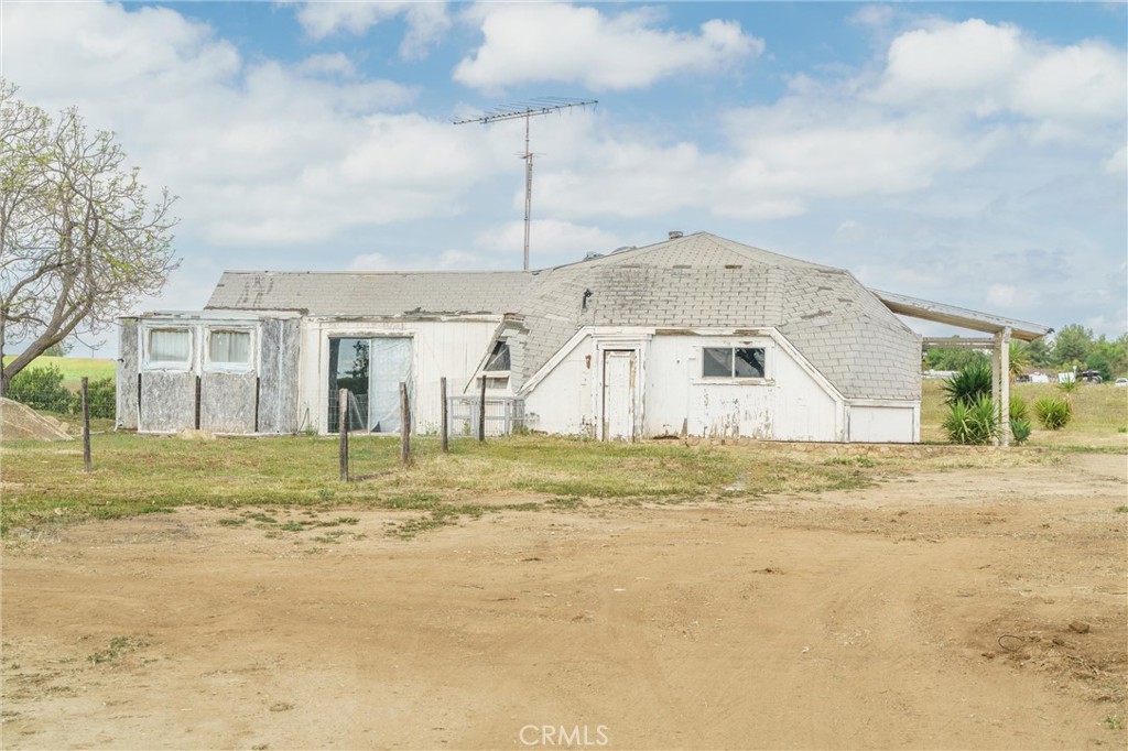 33041 Briggs Road Menifee, CA 92584 - Photo 30 of 60 a big white house with a big yard and big trees