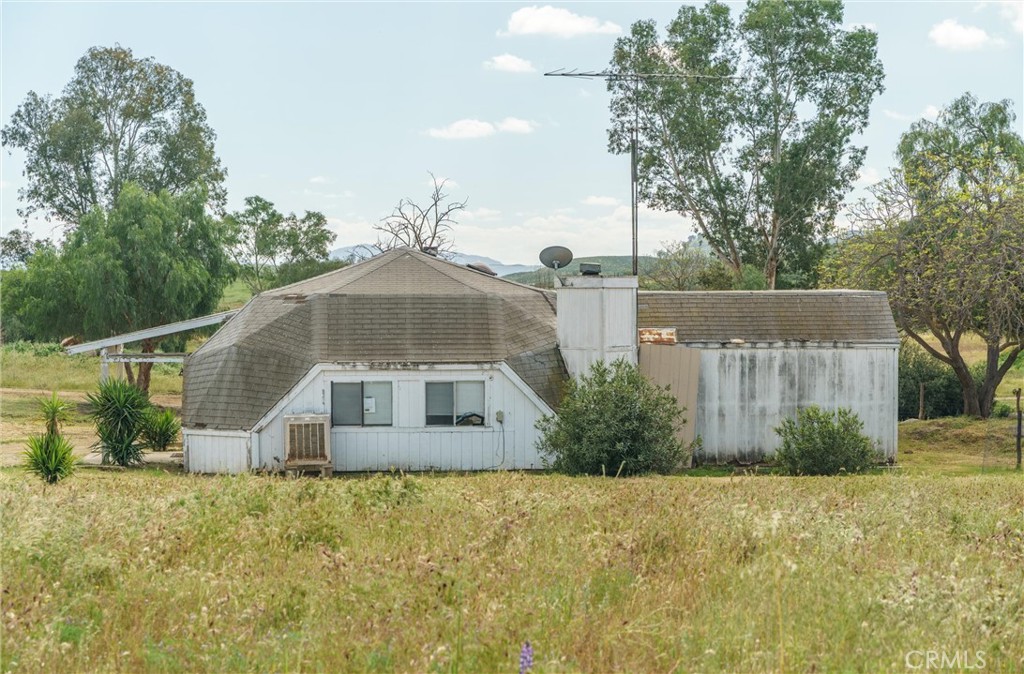 33041 Briggs Road Menifee, CA 92584 - Photo 35 of 60 a front view of a house with garden