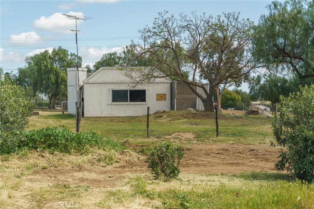 33041 Briggs Road Menifee, CA 92584 - Photo 38 of 60 a white house that has a tree in front of a yard