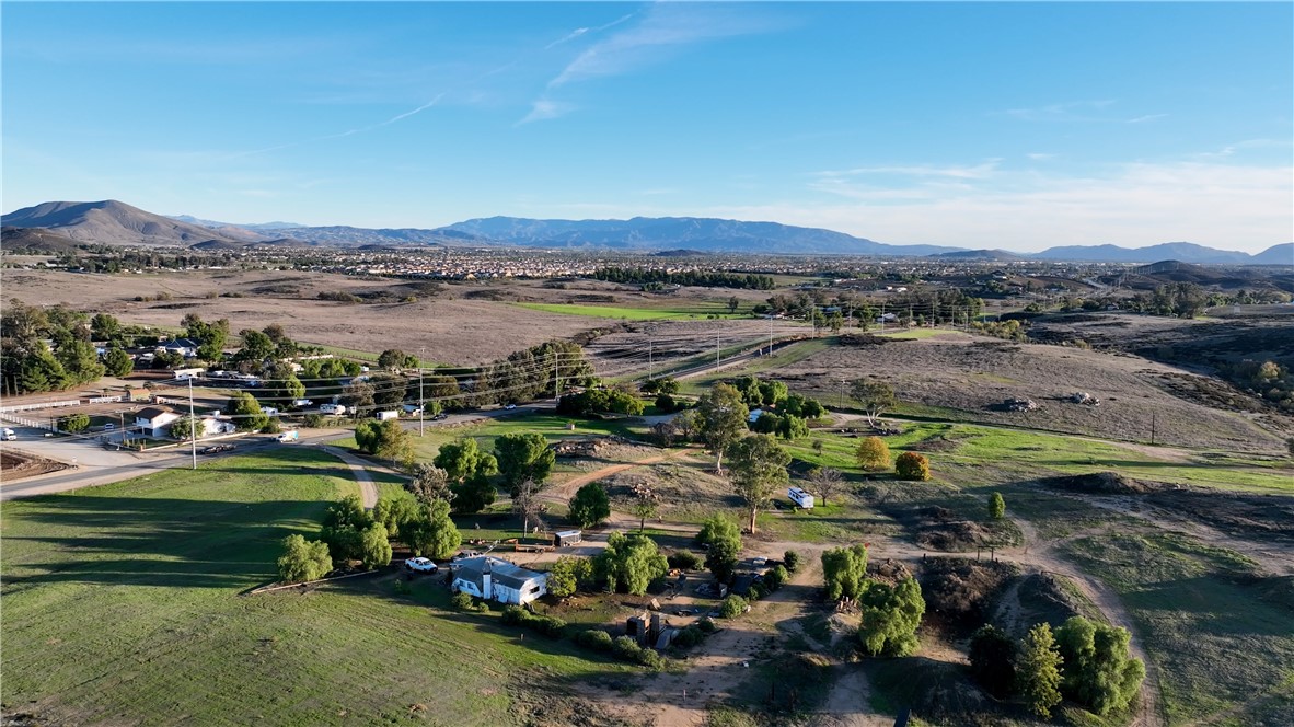 33041 Briggs Road Menifee, CA 92584 - Photo 7 of 11 a view of a town with residential houses and lake view