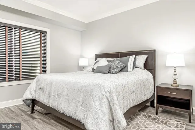 a bedroom with a bed and a lamp