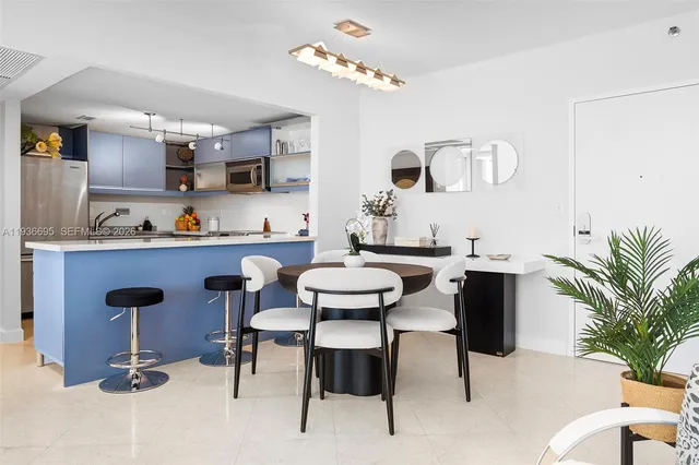 a living room with furniture fireplace and potted plant