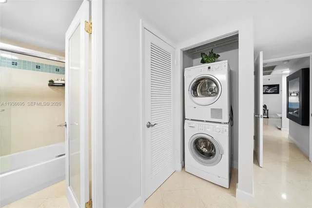 a vase of flowers sitting on a table with a couch