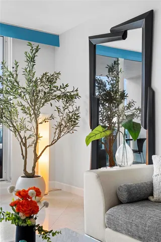 a view of a balcony with chair and a potted plant