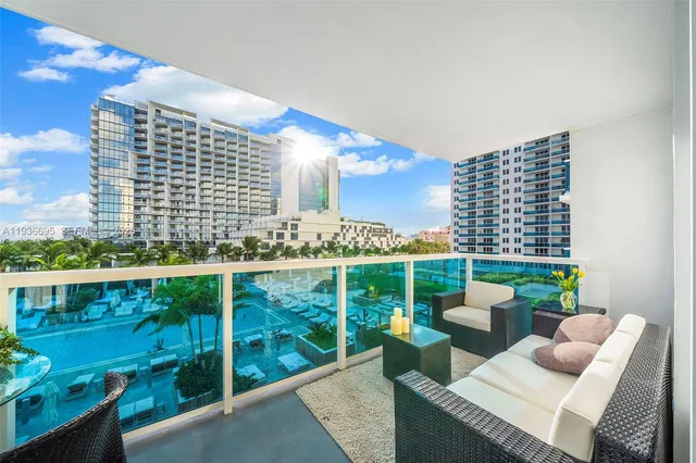 a view of a balcony with chairs