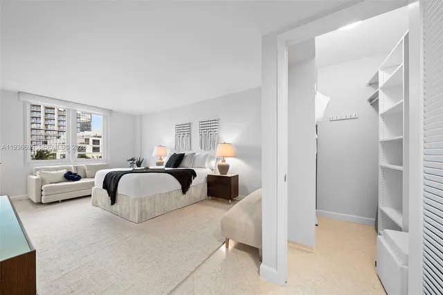 a dining room with furniture and a potted plant