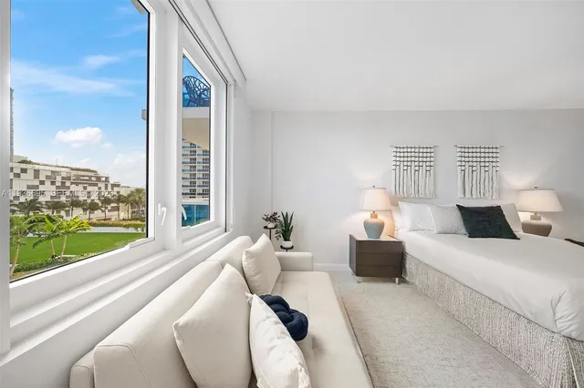 a bathroom with a shower a toilet and a tub