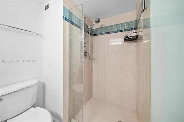 a living room with furniture and flowers