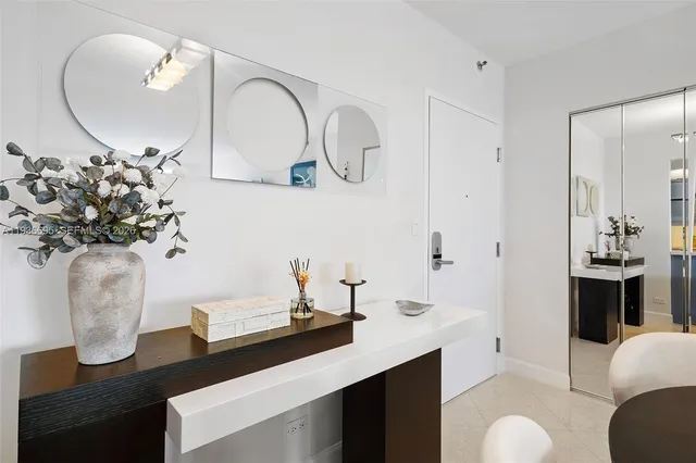 a kitchen with stainless steel appliances granite countertop a sink refrigerator and cabinets