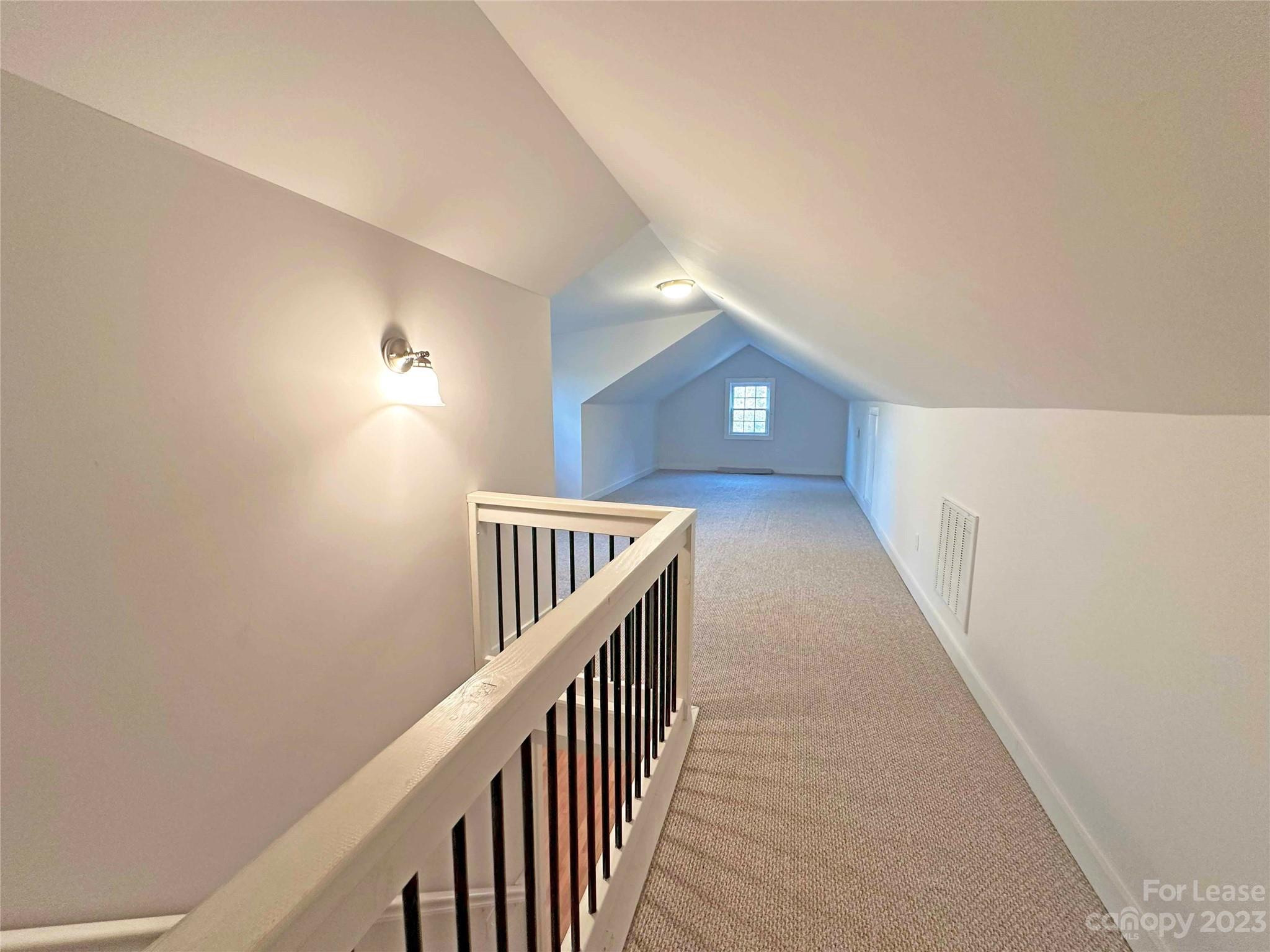 Undisclosed Address Hickory, NC 28601 - Photo 11 of 19 a view of a hallway with wooden floor and staircase