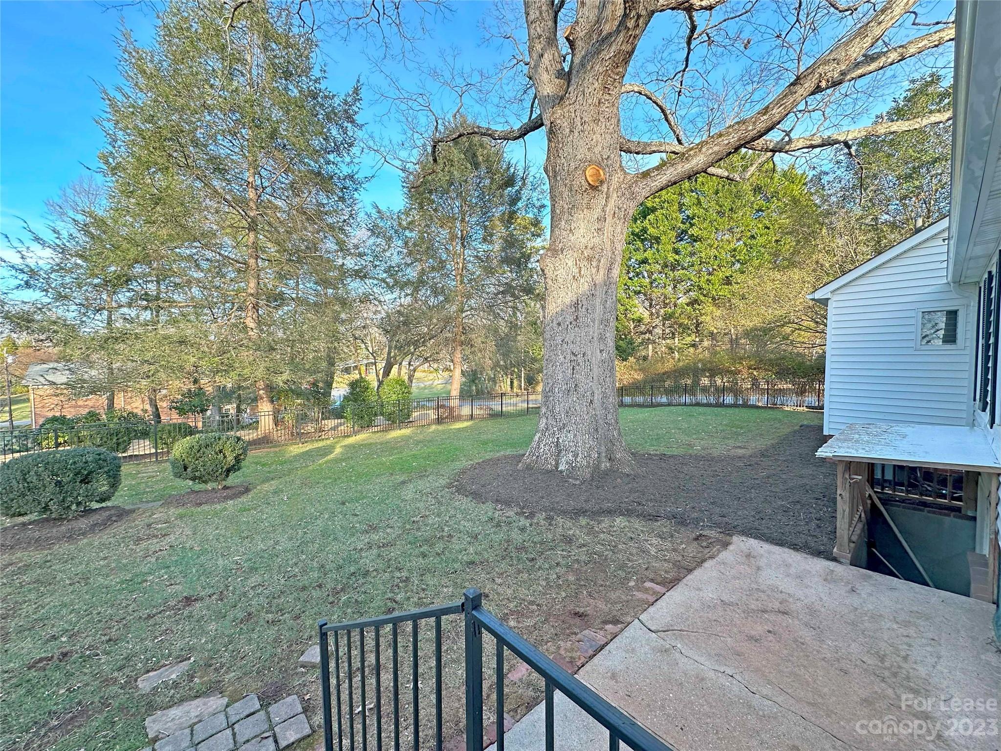 Undisclosed Address Hickory, NC 28601 - Photo 3 of 19 a backyard of a house with lots of green space