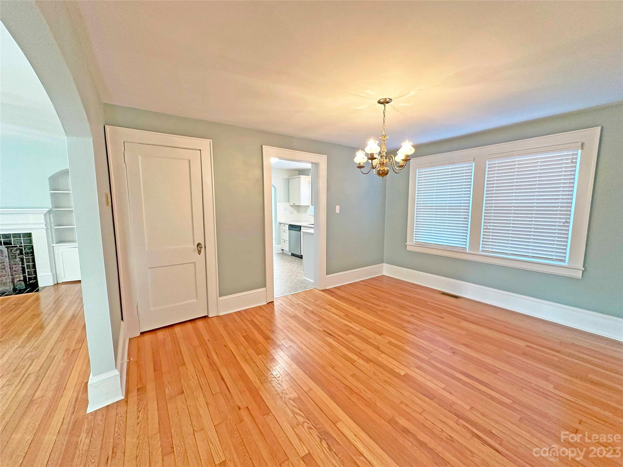 Undisclosed Address Hickory, NC 28601 - Photo 5 of 19 a view of an empty room with wooden floor and a window