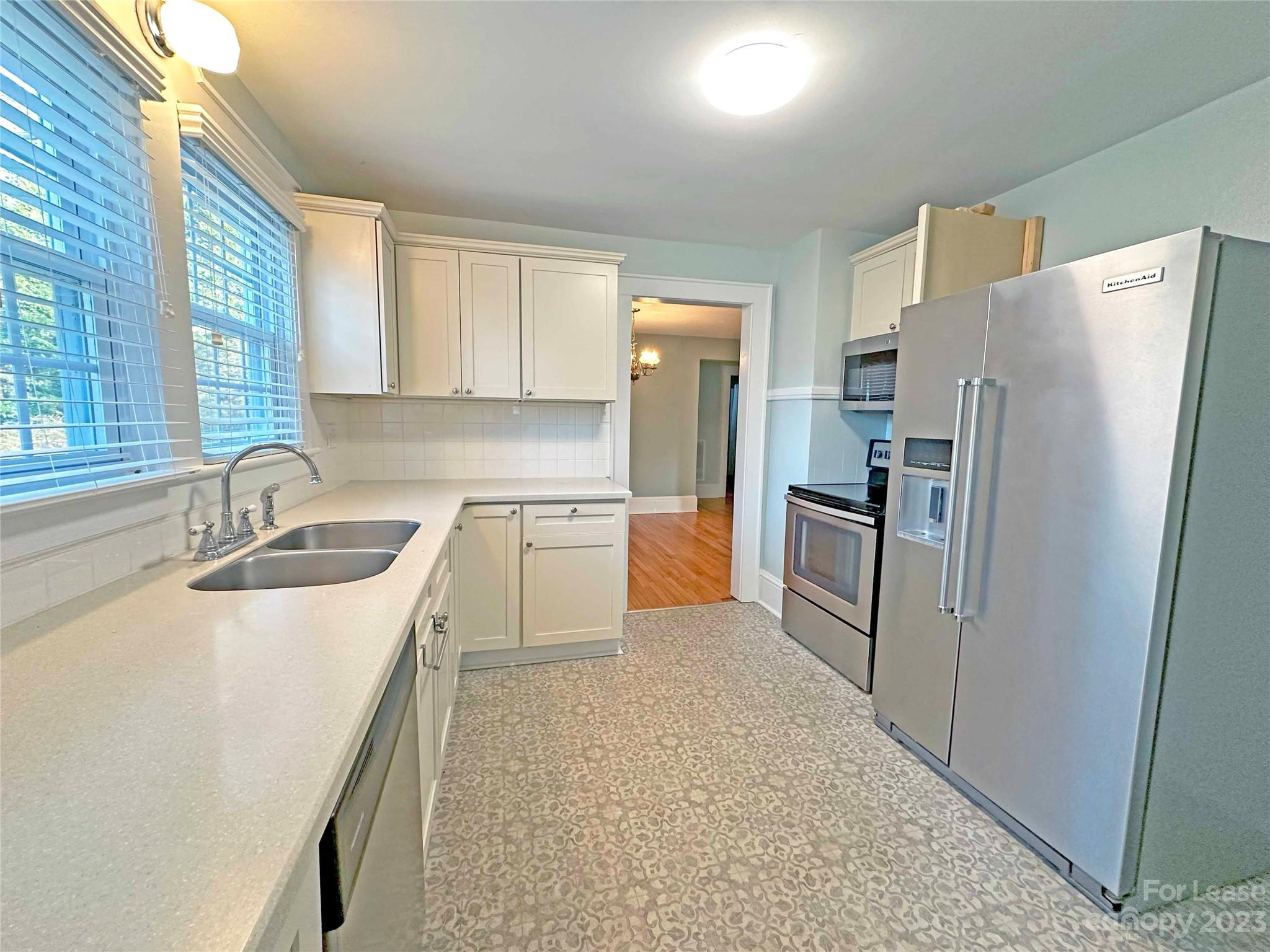 Undisclosed Address Hickory, NC 28601 - Photo 7 of 19 a kitchen with a sink refrigerator and window