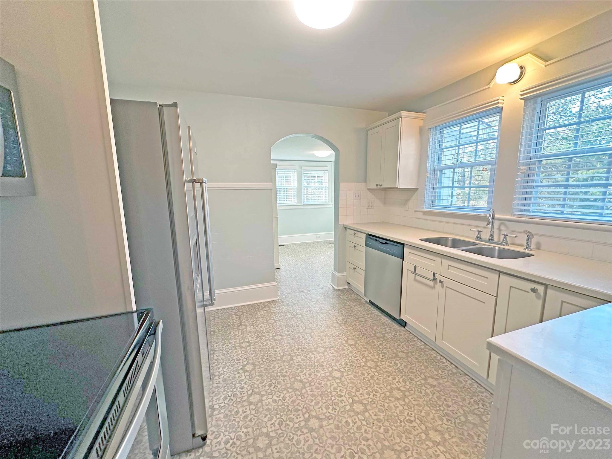 Undisclosed Address Hickory, NC 28601 - Photo 8 of 19 a large kitchen with a sink a window and stainless steel appliances