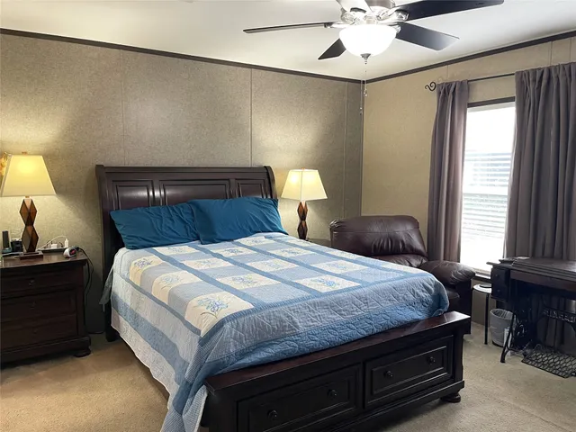 a bedroom with bed and window