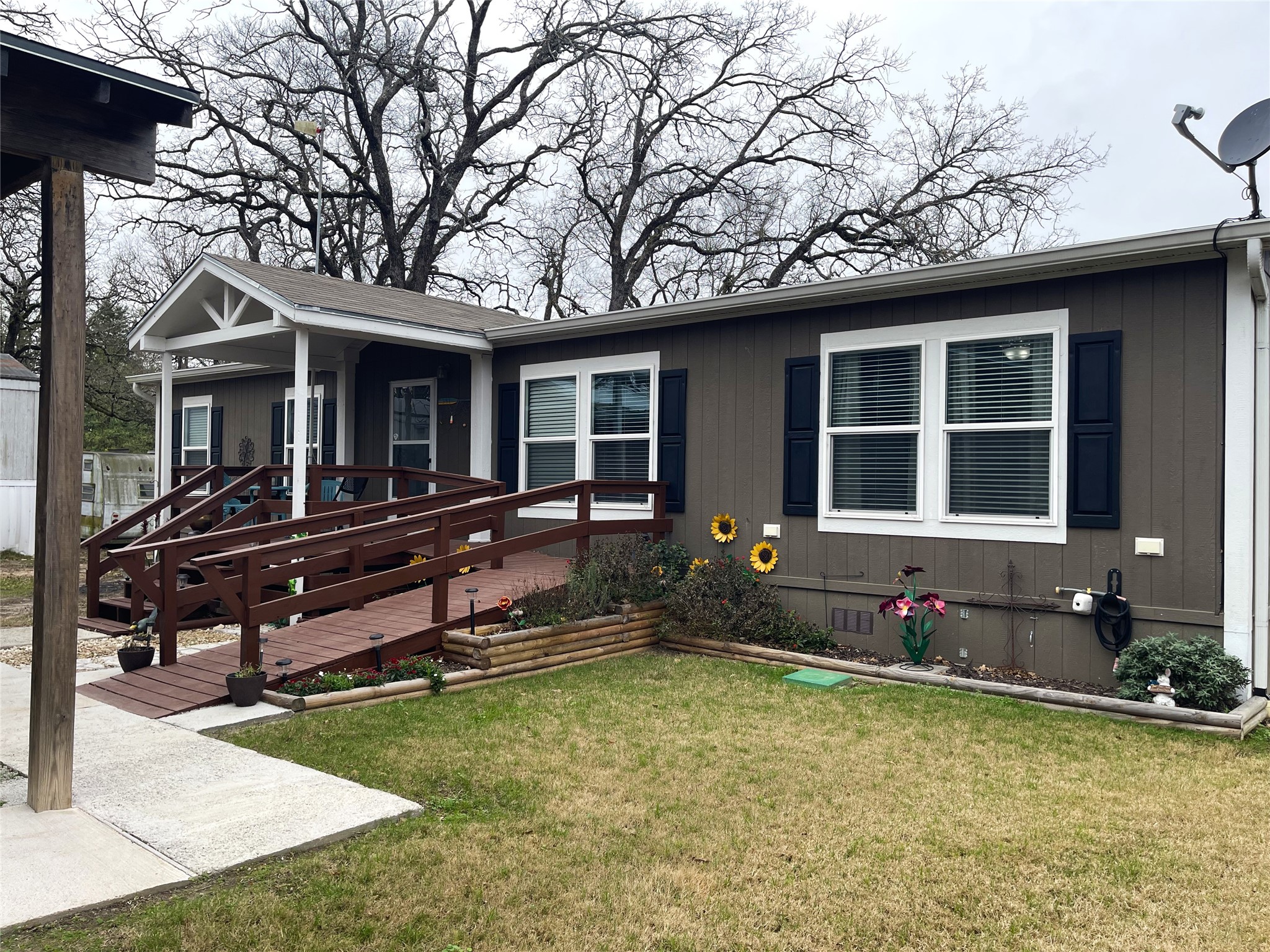 351 Clb Lk Road Teague, TX 75860 - Photo 2 of 33 a front view of a house with a yard outdoor seating and barbeque oven