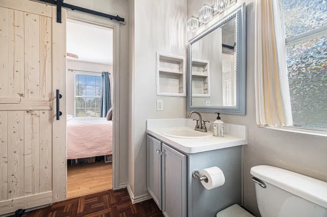 a en suite bathroom with a sink and a mirror