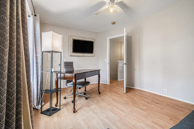 a view of a livingroom with furniture and a flat screen tv