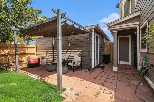 a view of a two chairs in the back yard