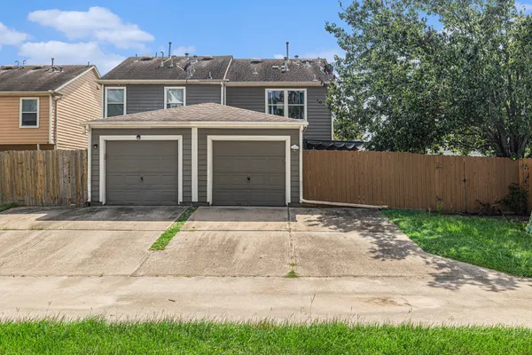 a front view of a house with a garage