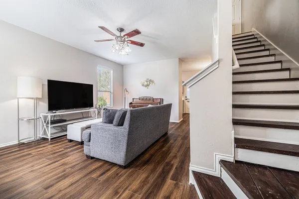 a living room with furniture and a flat screen tv