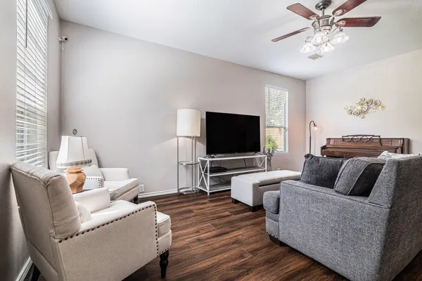 a living room with furniture and a flat screen tv