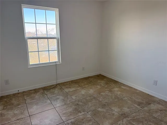 an empty room with a empty space and window