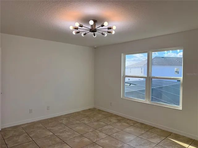 a view of a room with a chandelier