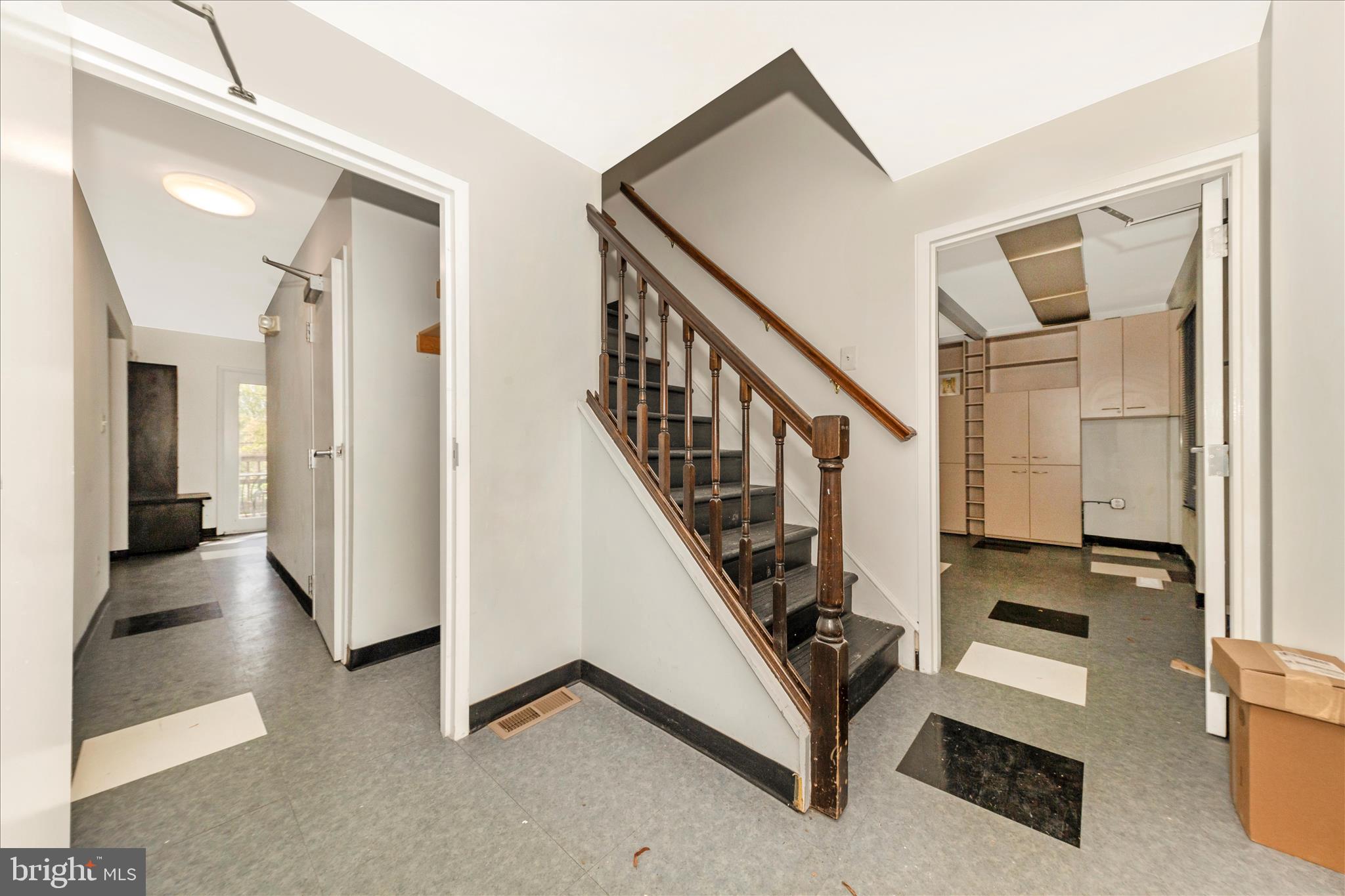 9309 Old Georgetown Road Bethesda, MD 20814 - Photo 16 of 50 a view of a hallway with staircase