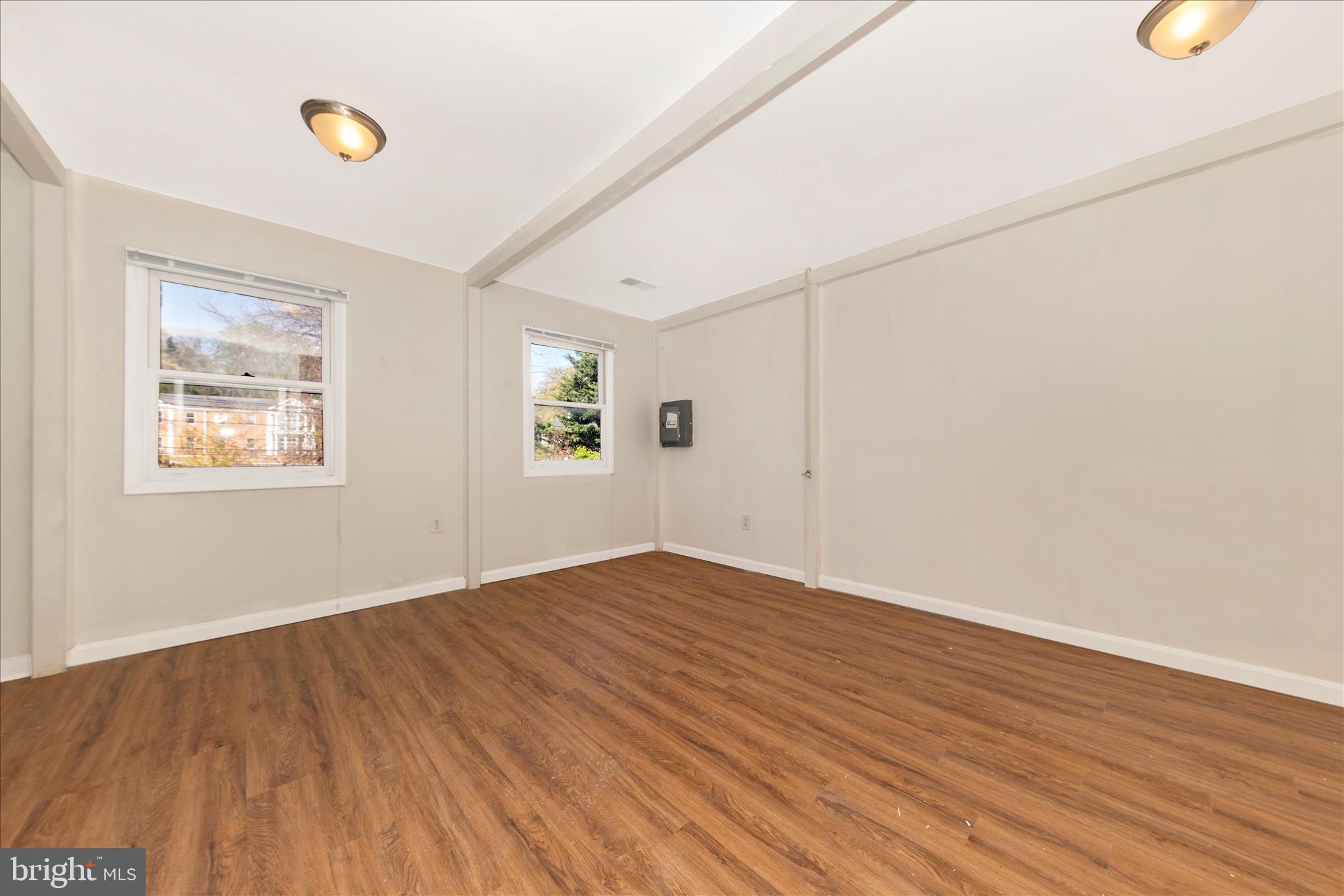 9309 Old Georgetown Road Bethesda, MD 20814 - Photo 17 of 50 a view of empty room with wooden floor and fan