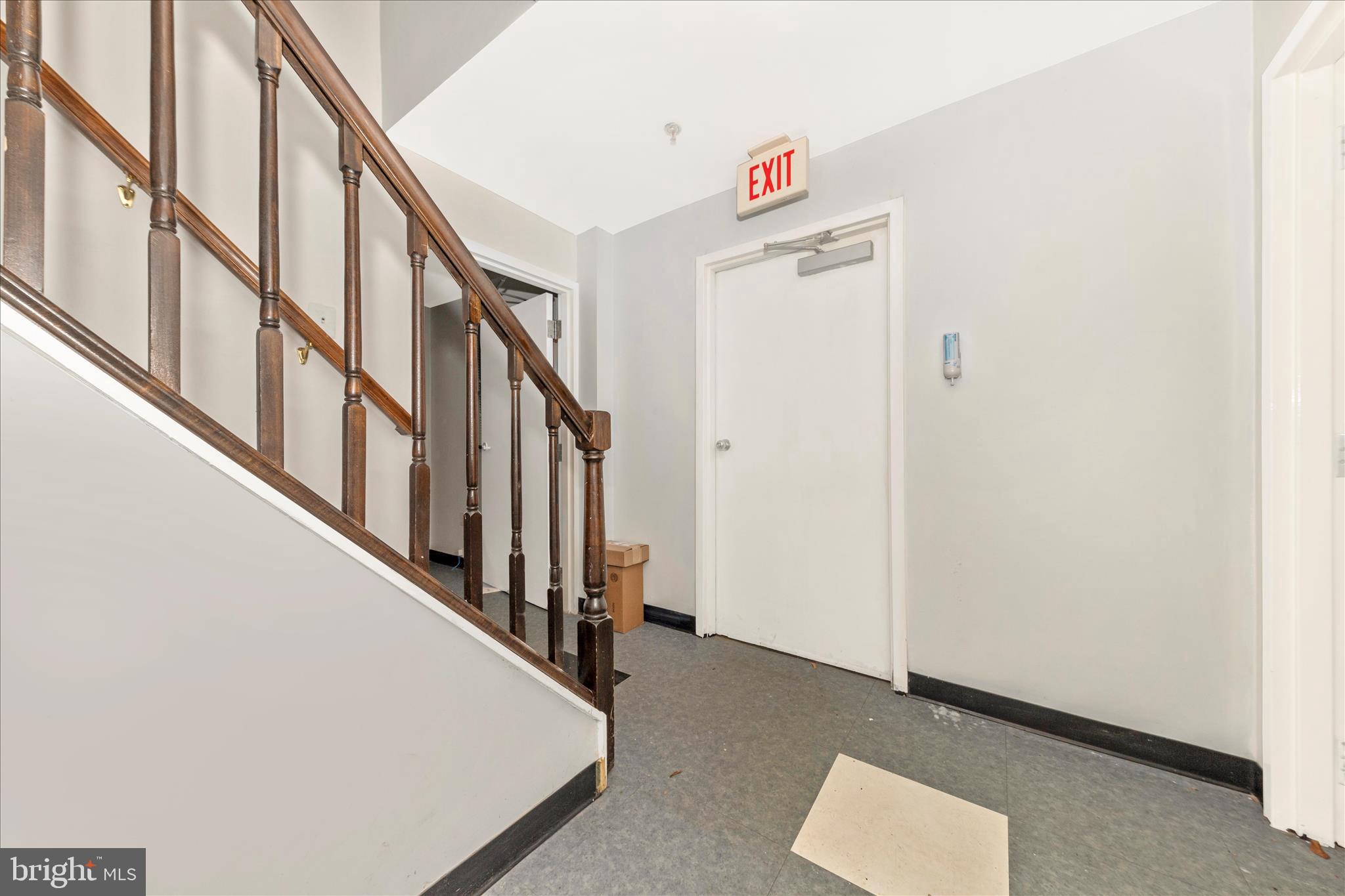9309 Old Georgetown Road Bethesda, MD 20814 - Photo 2 of 50 a view of staircase with white walls and a window