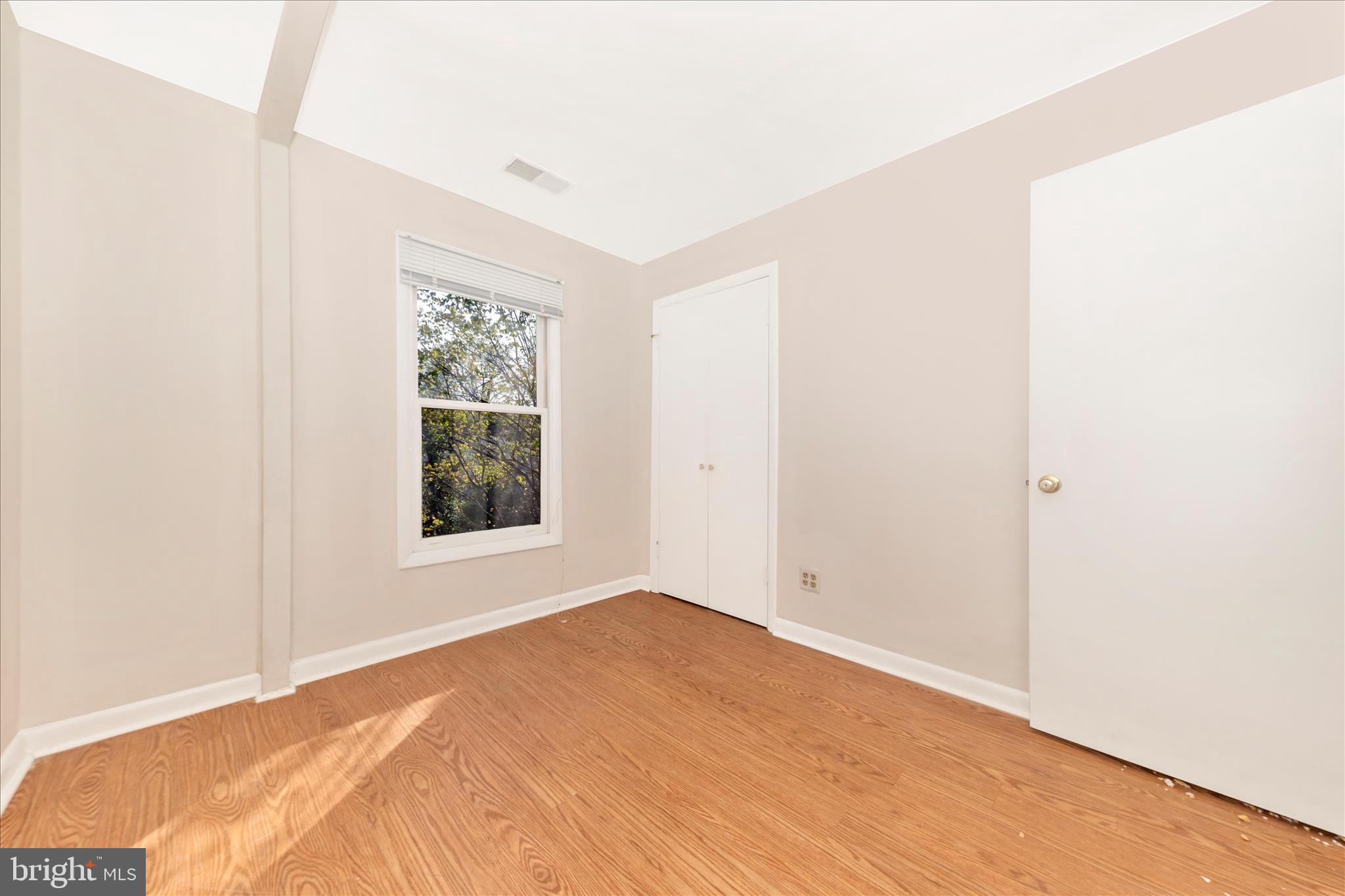 9309 Old Georgetown Road Bethesda, MD 20814 - Photo 23 of 50 a view of a big room with wooden floor and windows