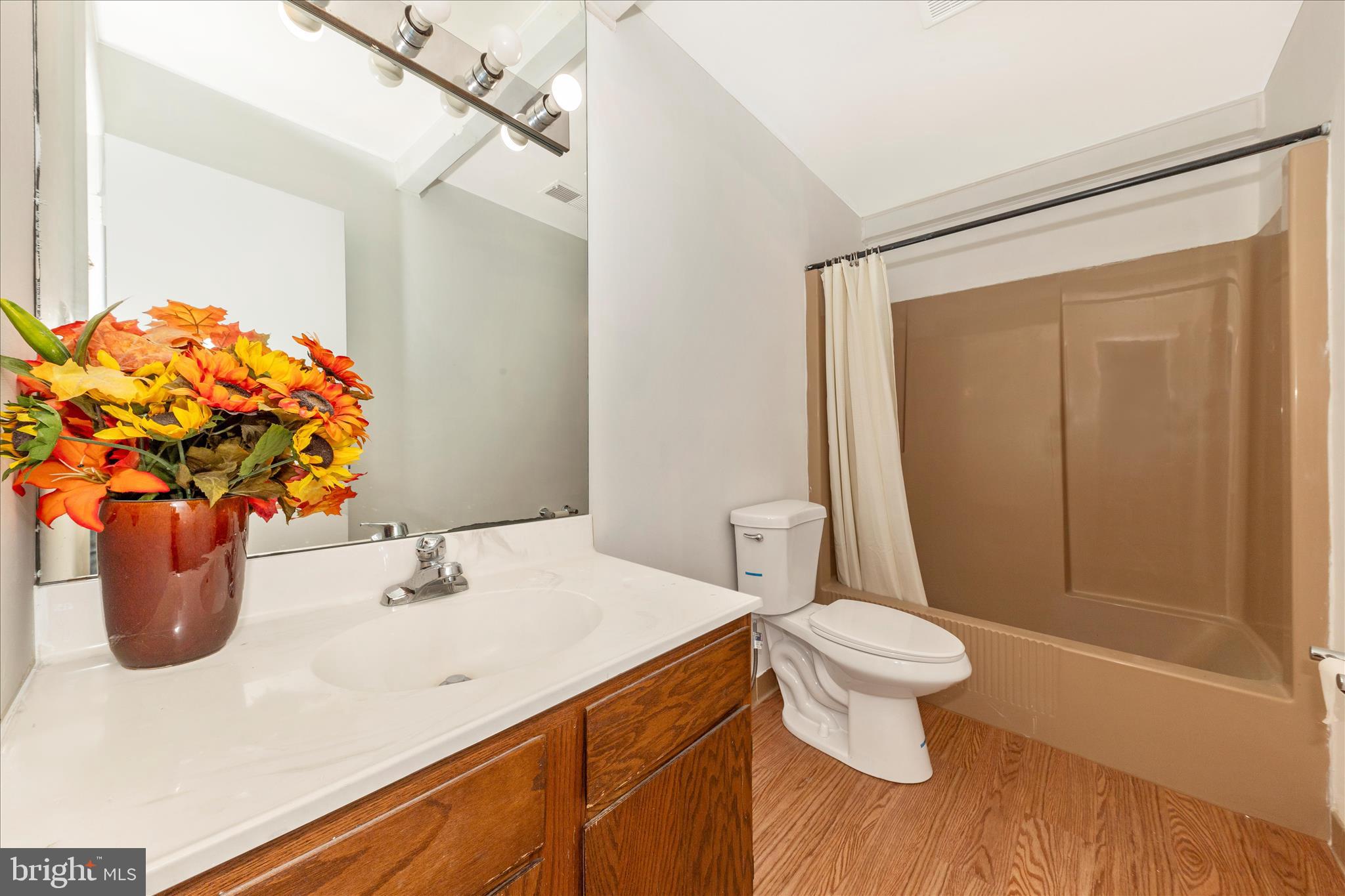 9309 Old Georgetown Road Bethesda, MD 20814 - Photo 28 of 50 a bathroom with a sink a toilet and shower