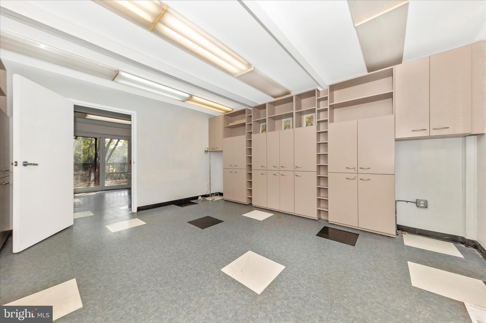 9309 Old Georgetown Road Bethesda, MD 20814 - Photo 3 of 50 an empty room with windows