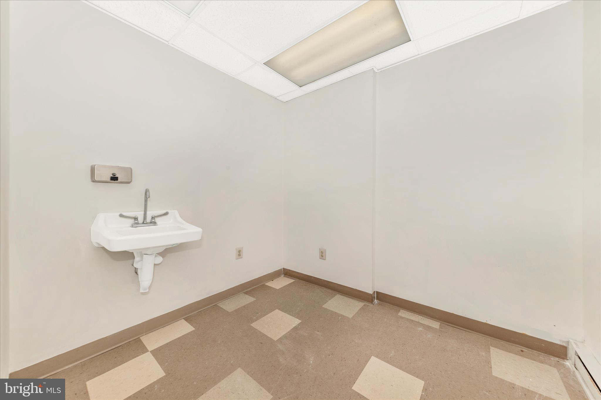 9309 Old Georgetown Road Bethesda, MD 20814 - Photo 35 of 50 a view of a room with a sink and a mirror