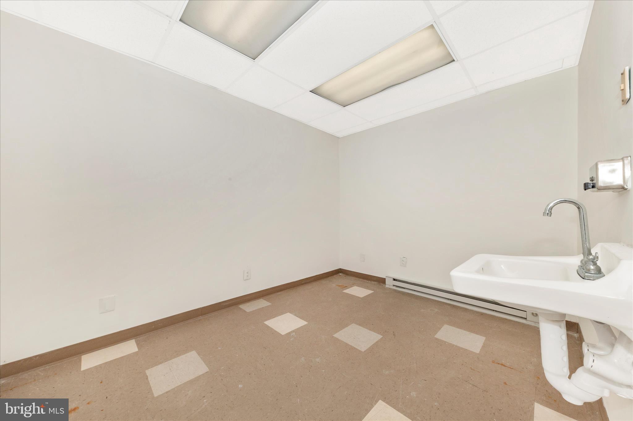 9309 Old Georgetown Road Bethesda, MD 20814 - Photo 36 of 50 a bathroom with a sink