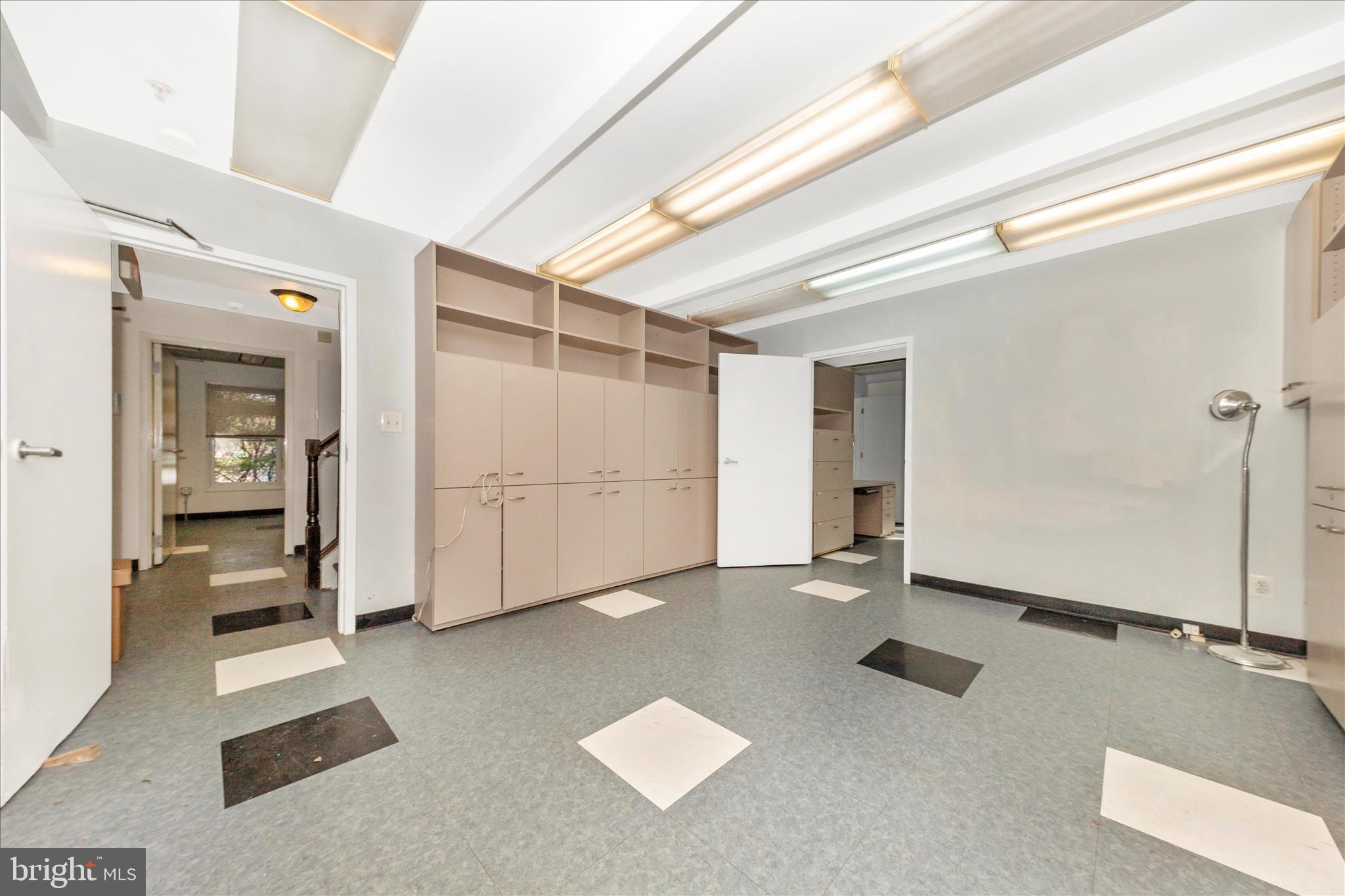 9309 Old Georgetown Road Bethesda, MD 20814 - Photo 4 of 50 a view of a livingroom with wooden floor and a bathroom